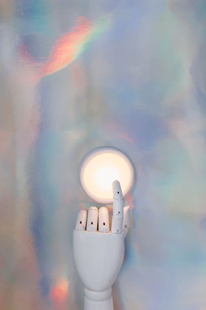 Crafting Captivating Headlines: Your awesome post title goes here A robotic hand reaching towards a glowing circle on a pastel abstract background, hinting at advanced technology.